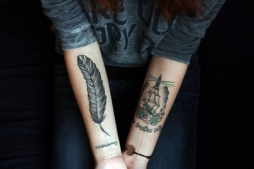 feather arm tattoo