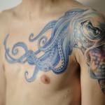 men shoulder and chest tattoo