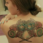 Owl girl back tattoo