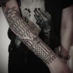 Arm pattern tattoo