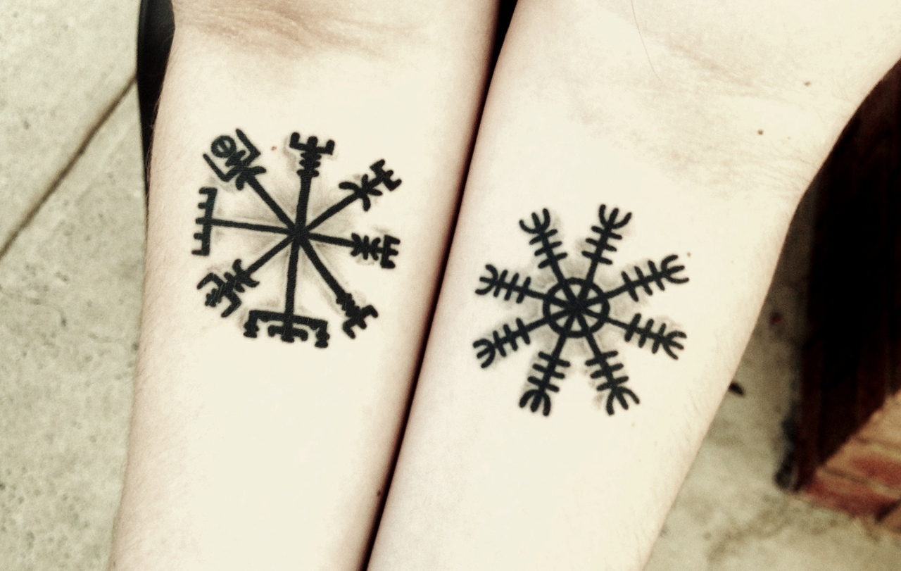 Arm symbols tattoo