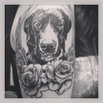Black and white dog tattoo