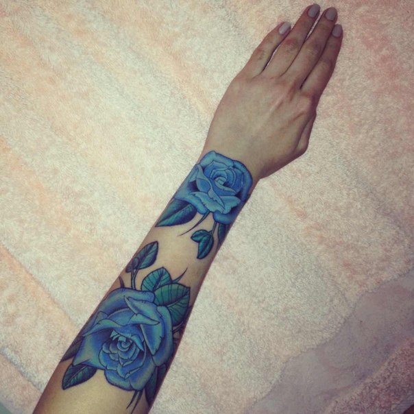 Blue flowers arm tattoo