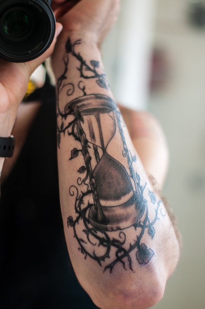 Cool sandclock arm tattoo