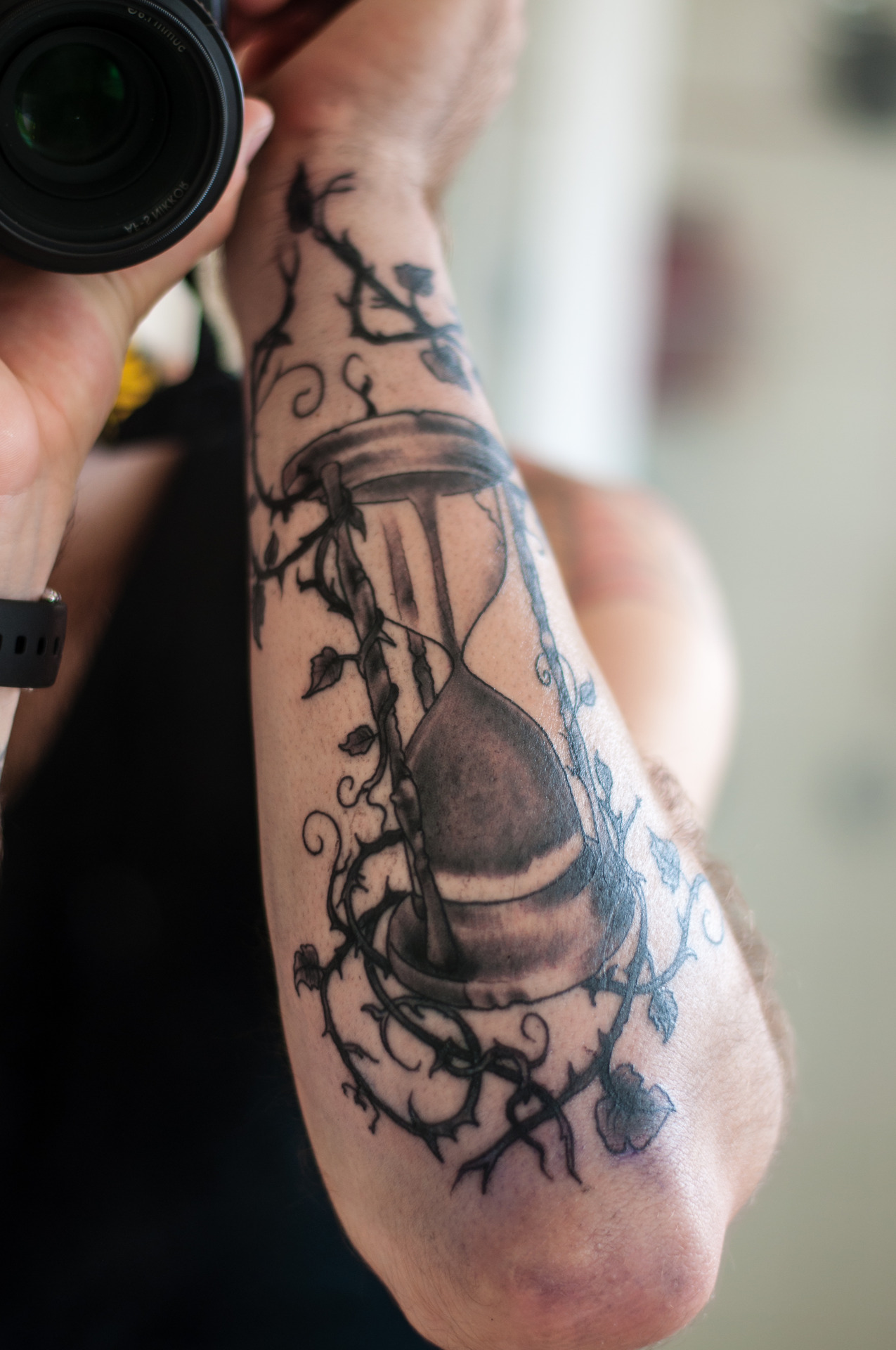 Cool sandclock arm tattoo