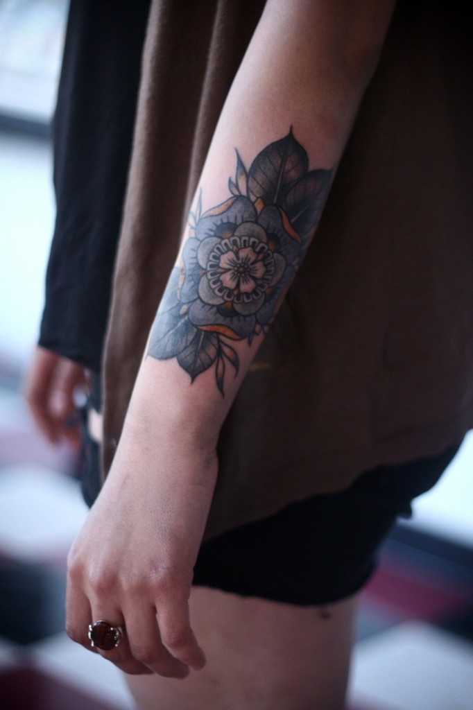 Cute floral arm tattoo