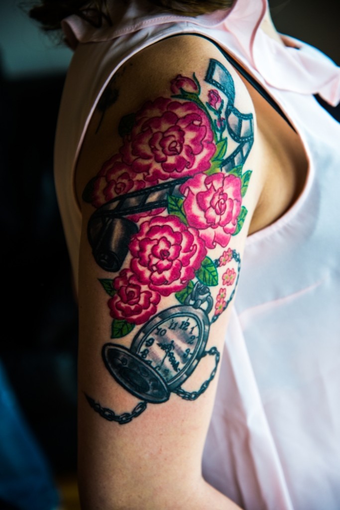 Flowers and clock sleeve tattoo