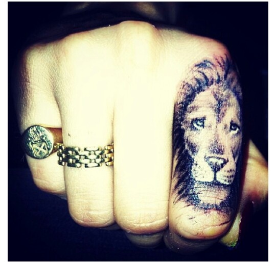 Lion hand tattoo