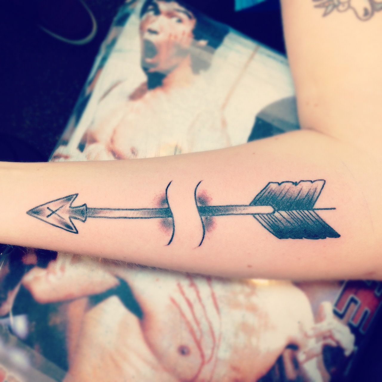 Minimal arrow tattoo