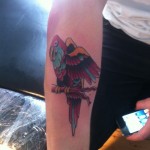 Parrot arm tattoo
