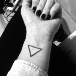 Simple black triangle tattoo