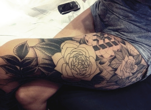 Floral girl's leg tattoo