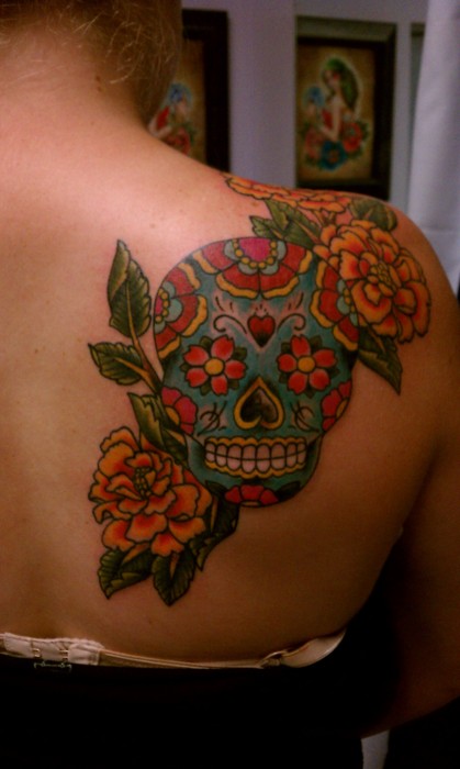 Floral skull back tattoo