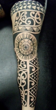 Tribal leg tattoo