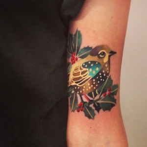 Stylized Bird Tattoo On Inner Arm