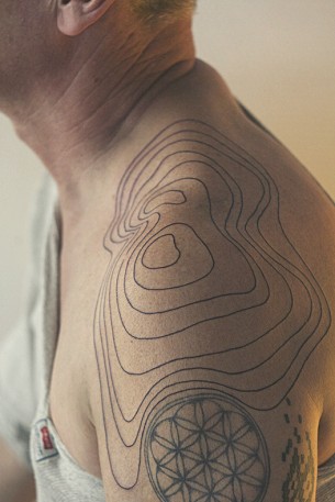Relief Lines Shoulder Tattoo