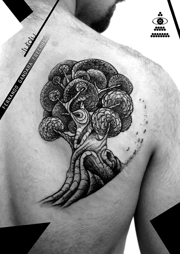 tree tattoo on shoulder blade