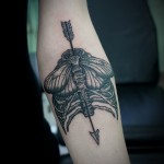 Arrow & Ribs Tattoo