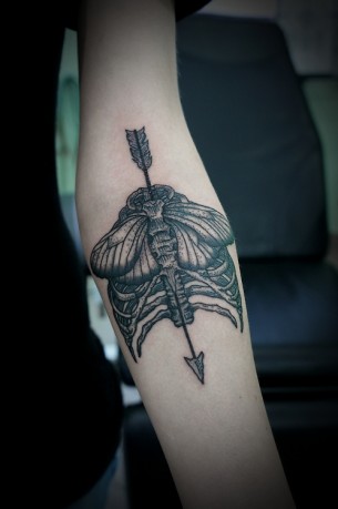 Arrow & Ribs Tattoo