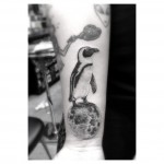 Penguin Arm Tattoo