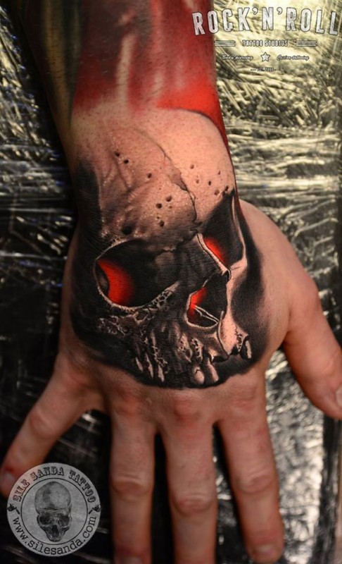 Red Glowing Skull Hand Tattoo