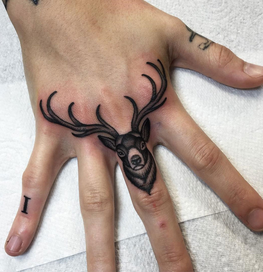 Buck Finger Tattoo