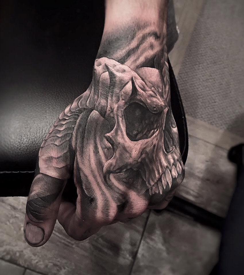 Skull with horns hand tattoo