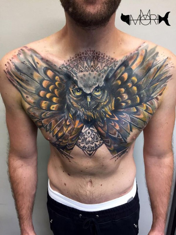 Owl cover up tattoo on chest