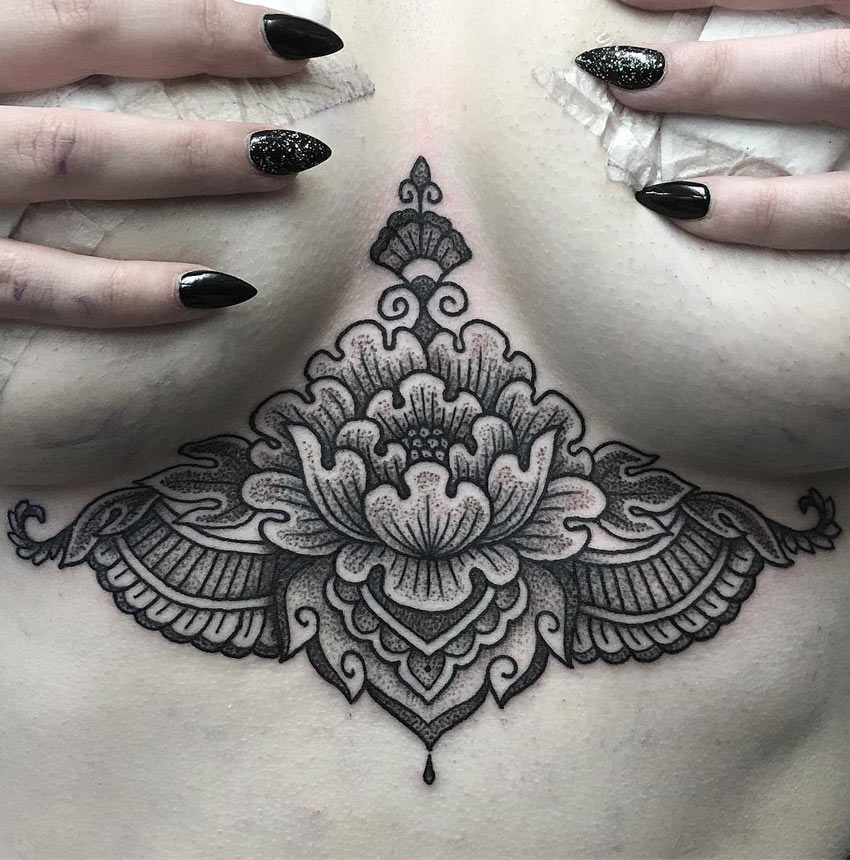 Lotus flower under boob by