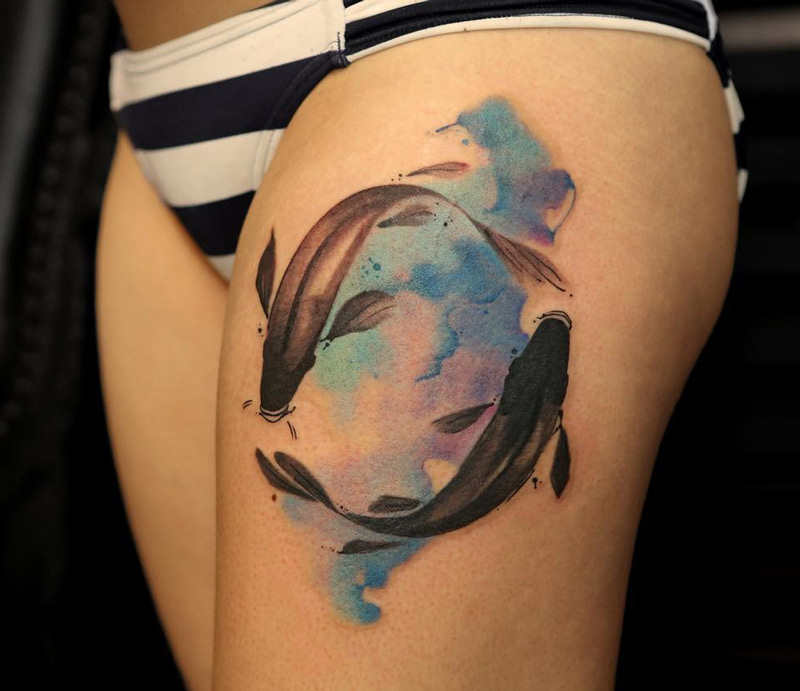 fish swimming thigh tattoo