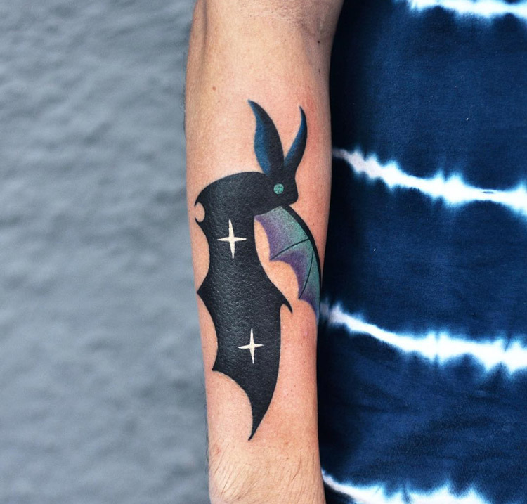Bat arm tattoo