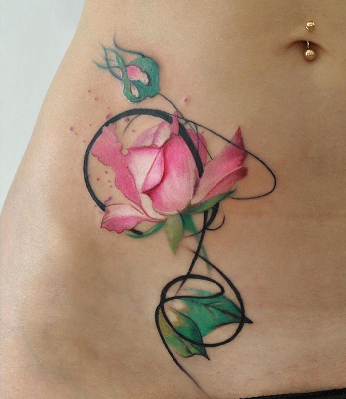 Pink rose girls stomach tattoo