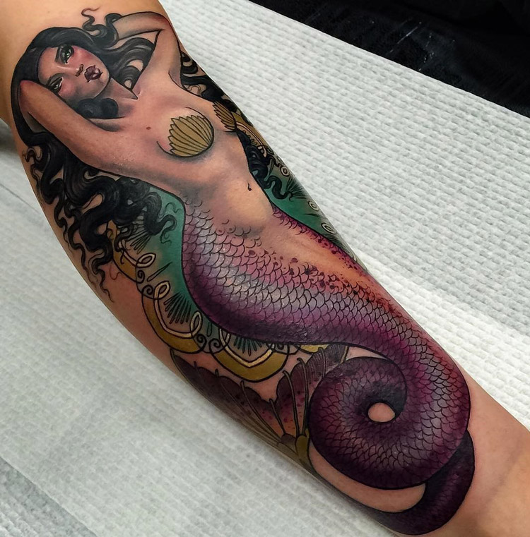 Mermaid tattoo on girls arm