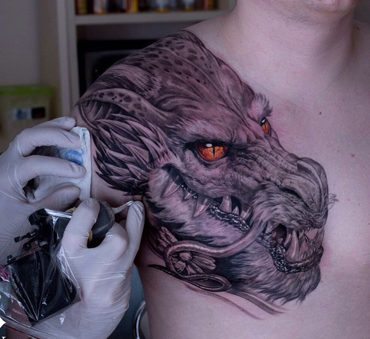 Dragon's Head with Fiery Oeage Eyes | Best tattoo design ideas