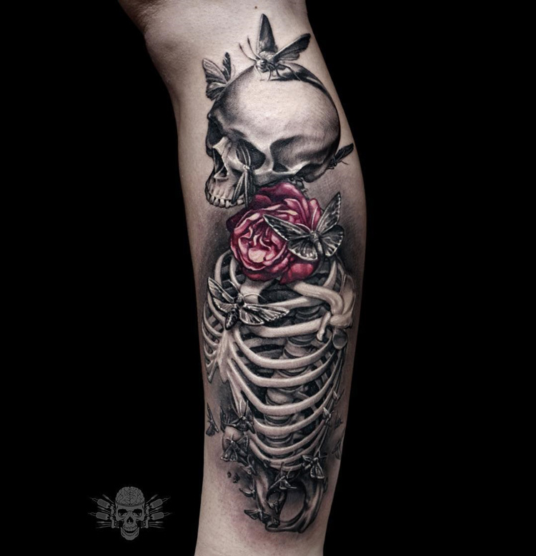 Skeleton with moths and a rose