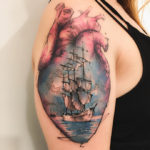 Heart & sailing ship arm tattoo