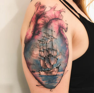Heart & sailing ship arm tattoo