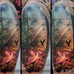 Forest tattoo with pink lily