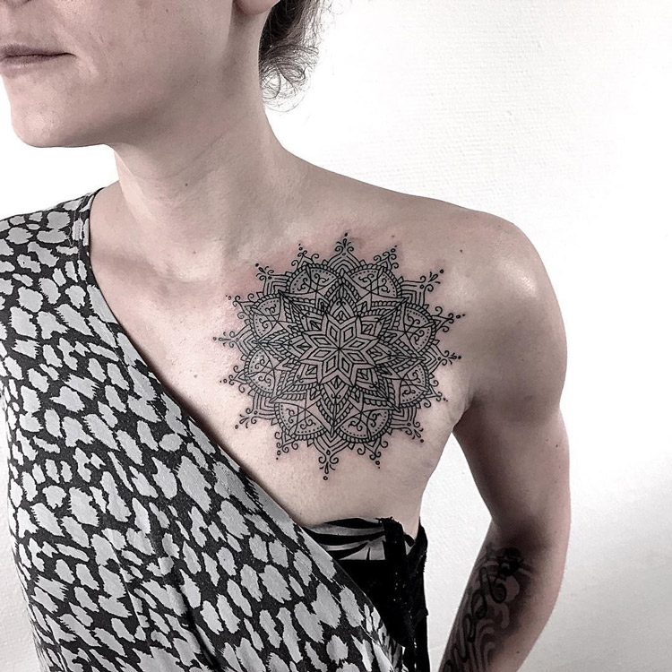 Black ink mandala on girls chest