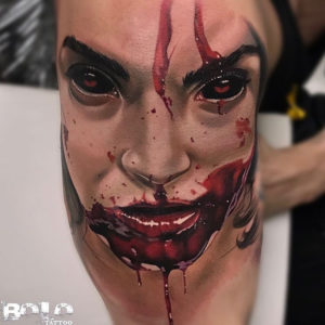 Evil face blood tattoo