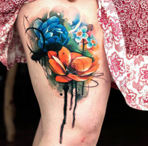 Colorful flowers girls thigh tattoo