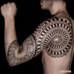 Optical illusion shoulder tattoo