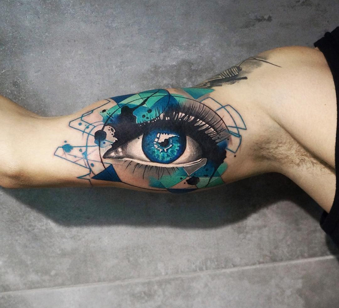 Abstract eye arm tattoo