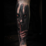 Devil with glowing eyes tattoo