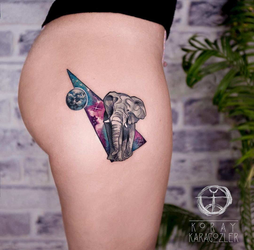 Space elephant hip tattoo