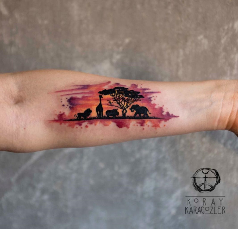 African animals watercolor arm tattoo