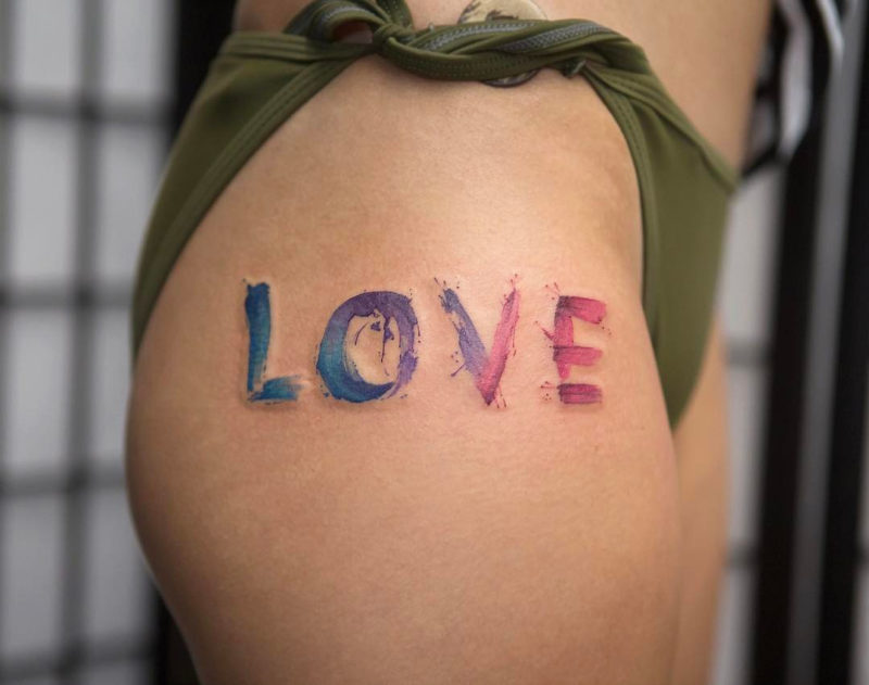 Love, word hip tattoo