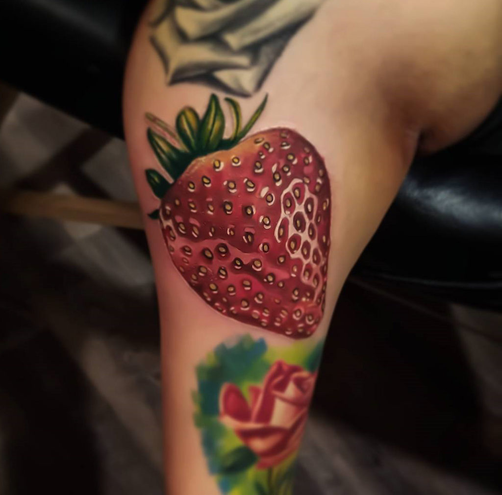 Realistic Strawberry Tattoo on Girls Upper Arm