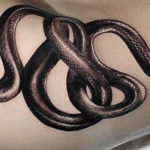 Snake hip tattoo