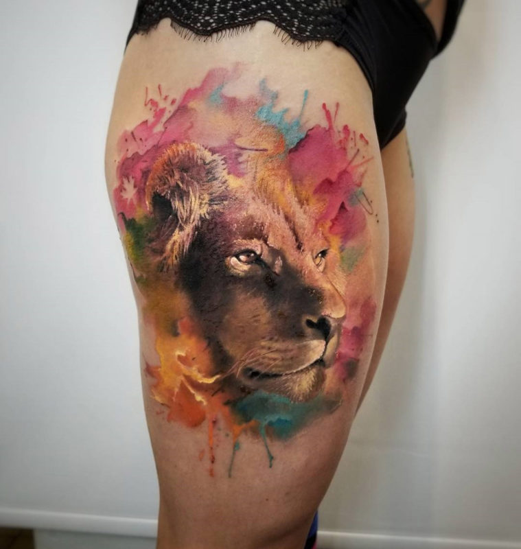 Realistic lion's face tattoo
